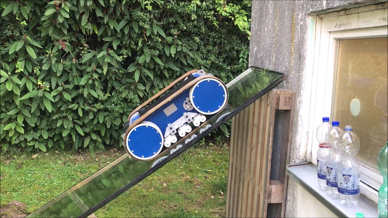 Remote controlled tracked vehicle for PV system cleaning