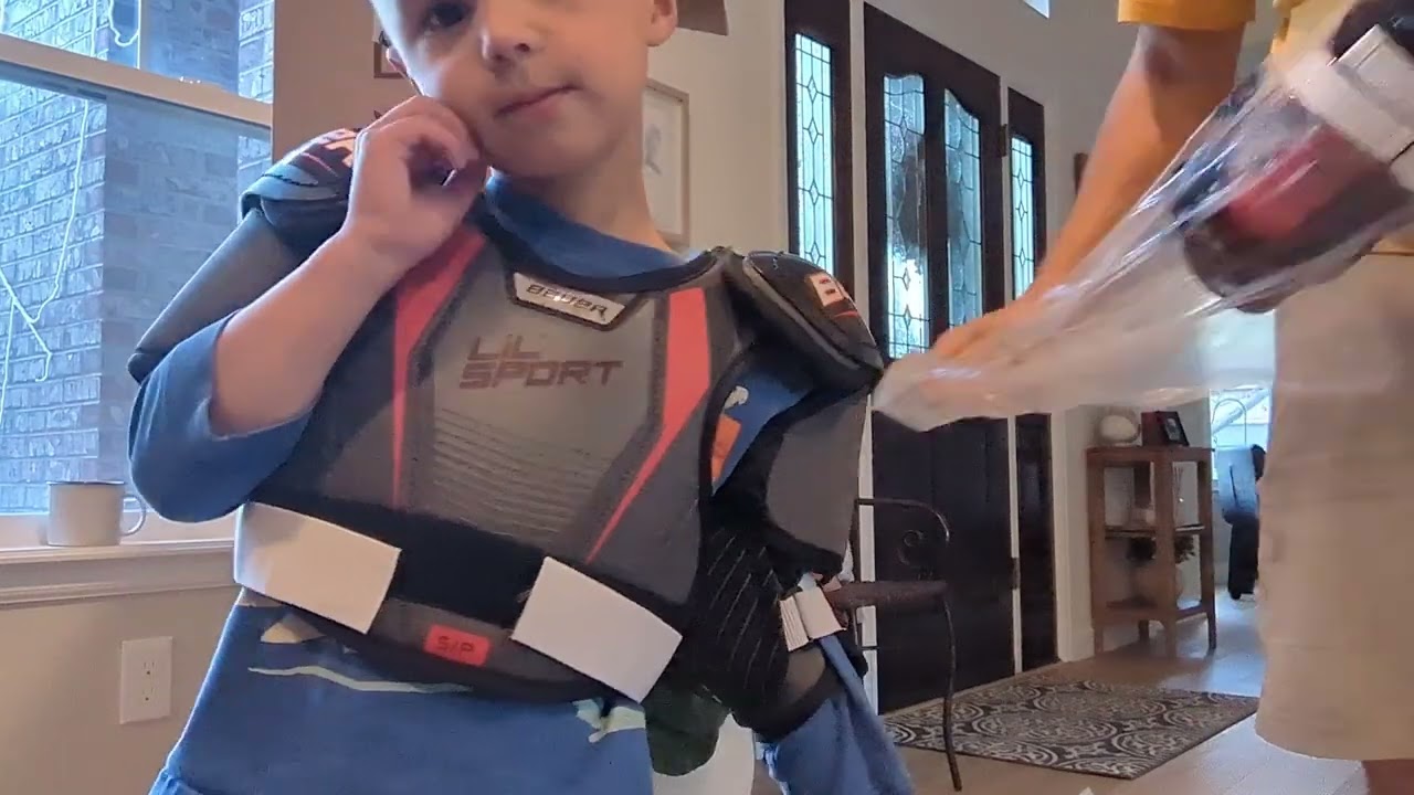 Son trying on hockey gear for the first time!