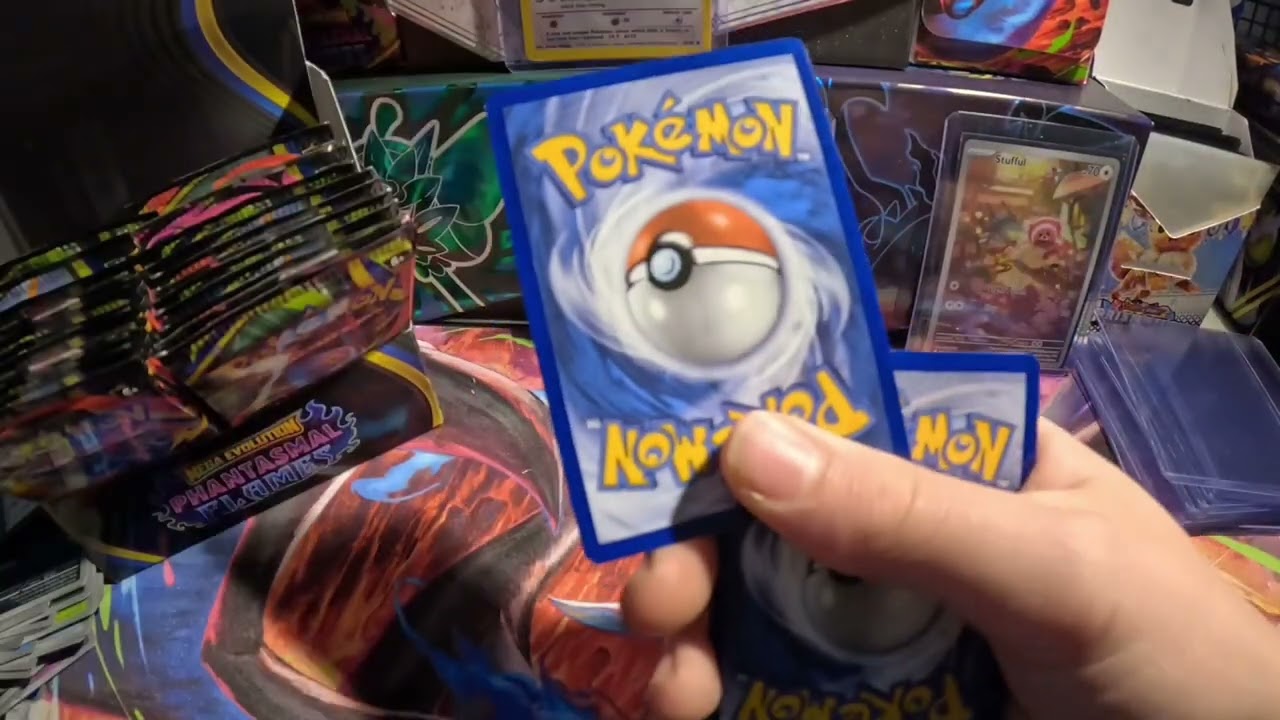 Opening a Booster Box of Phantasmal Flames (I pulled the Charizard) 