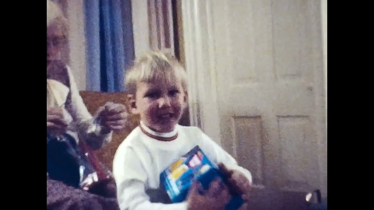 1973 December: Xmas Eve at Grandpa Rudat's; John 6, Steve 2, Kris 8 mos, Christopher 1