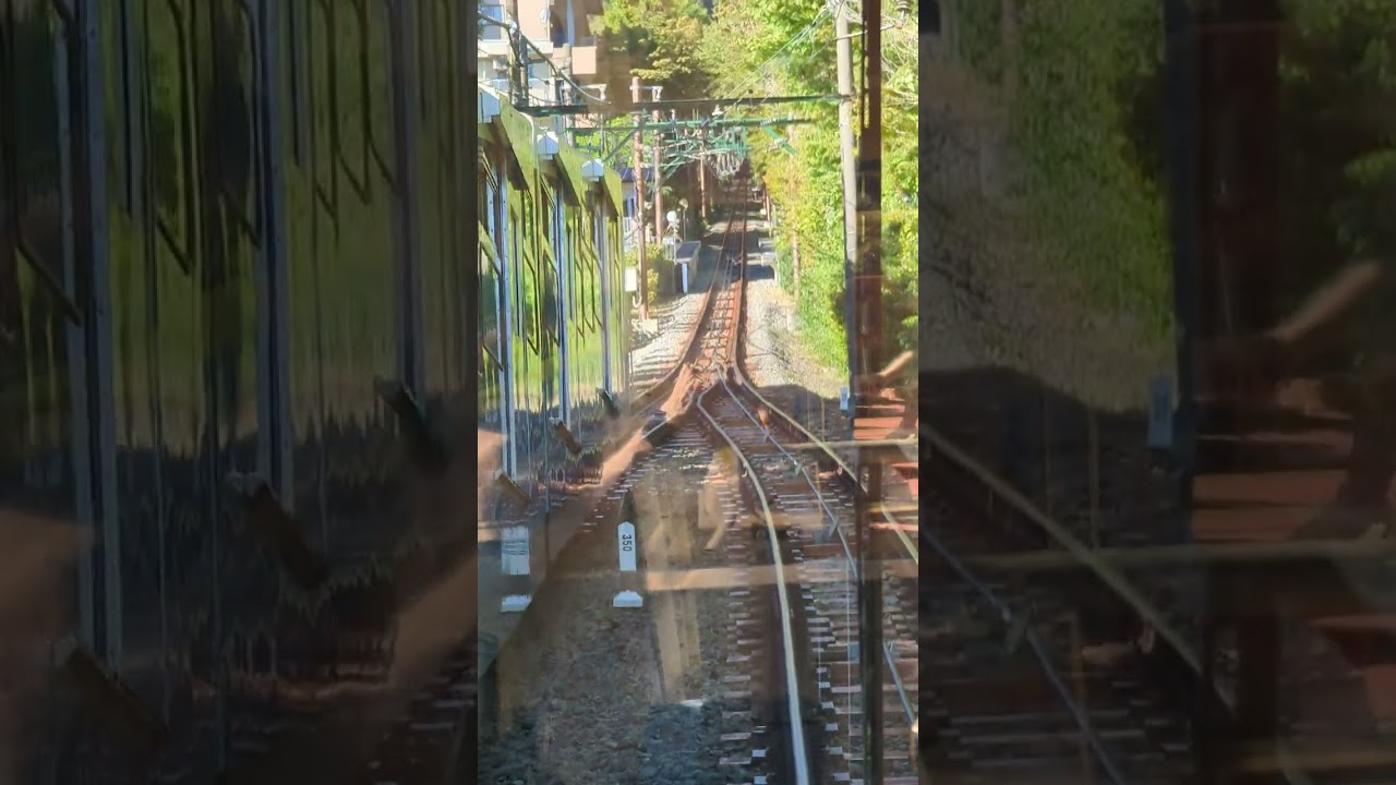 Hakone Tozan Cable Car ascending from Koen-kami to Naka-Gora and passing descending train