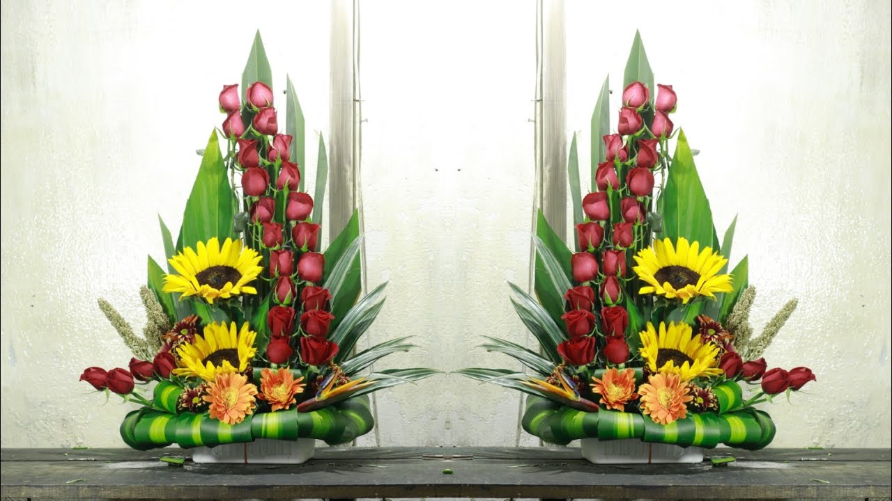 Arreglo floral de rosas./ girasoles