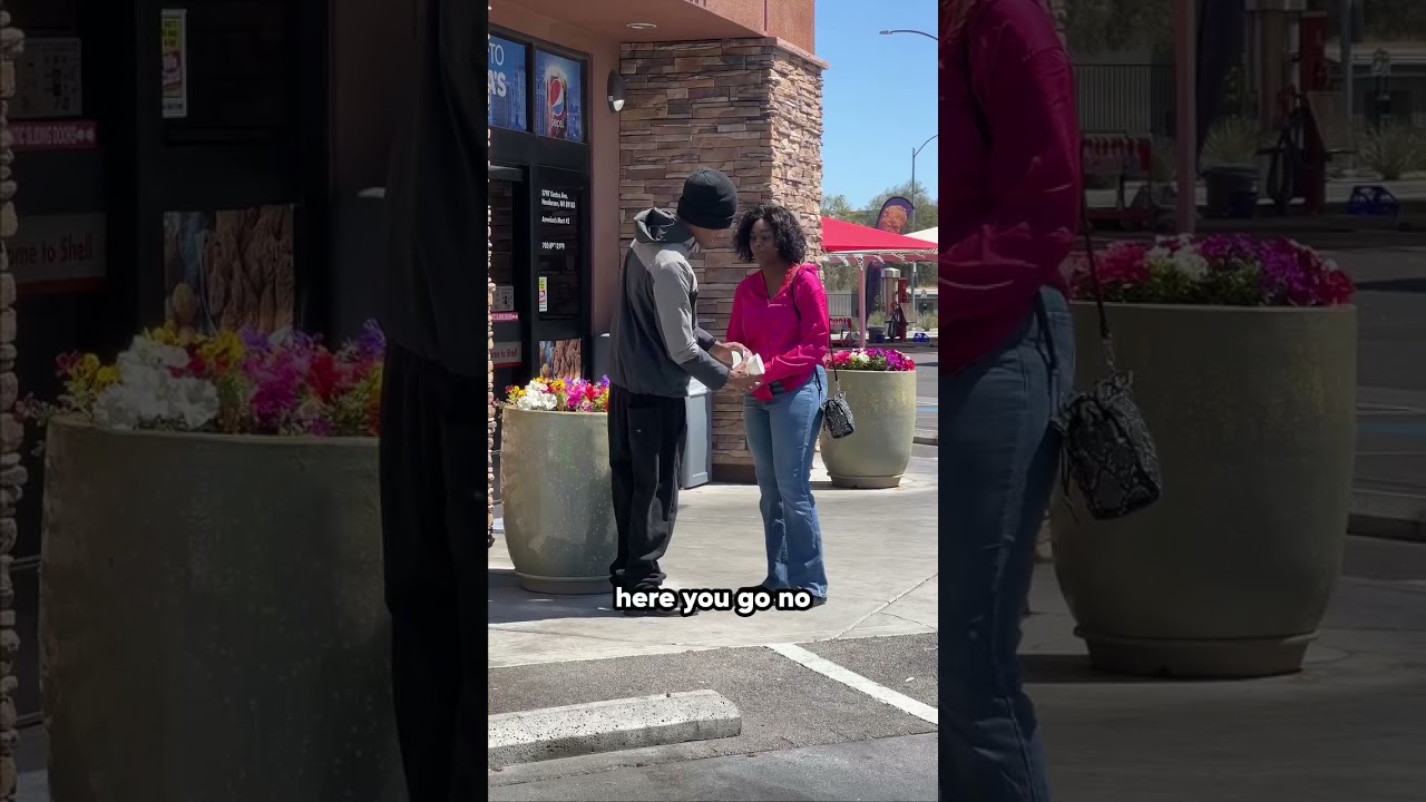 Homeless man helps struggling woman