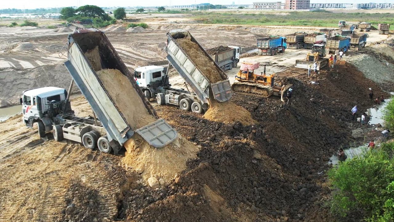 Finish Project Massive New Road Construction Bulldozer Spreading Dirt And 12 Wheel Dump Truck Unload