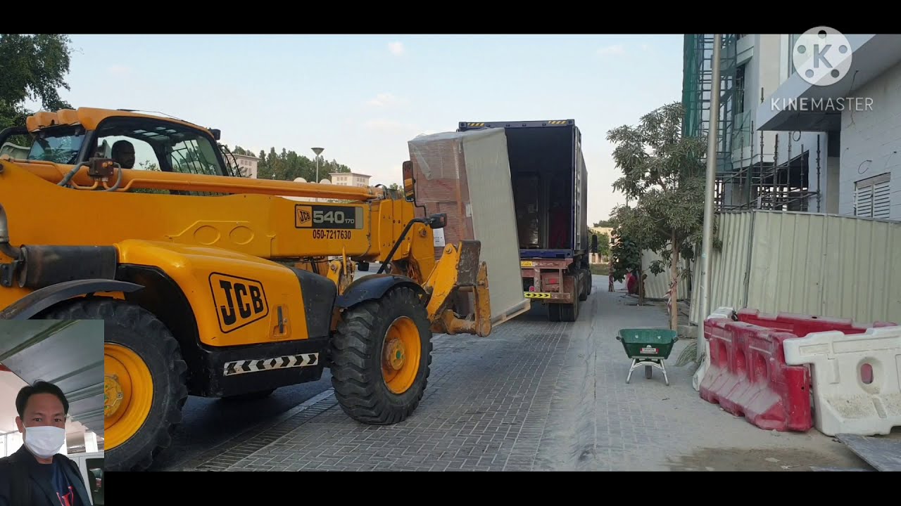 Unloading material's from container using boom loader (  Hammer TV )