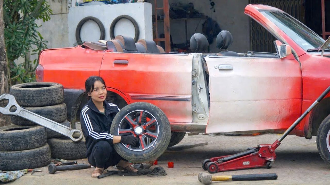The energetic repair girl she was very happy to be guided by her teacher on how to replace car brake