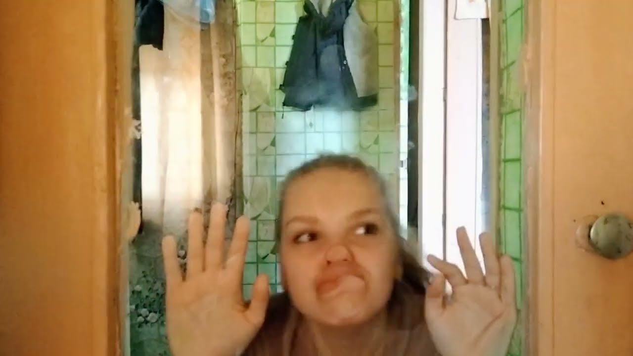 Girl squishing face against the glass 3