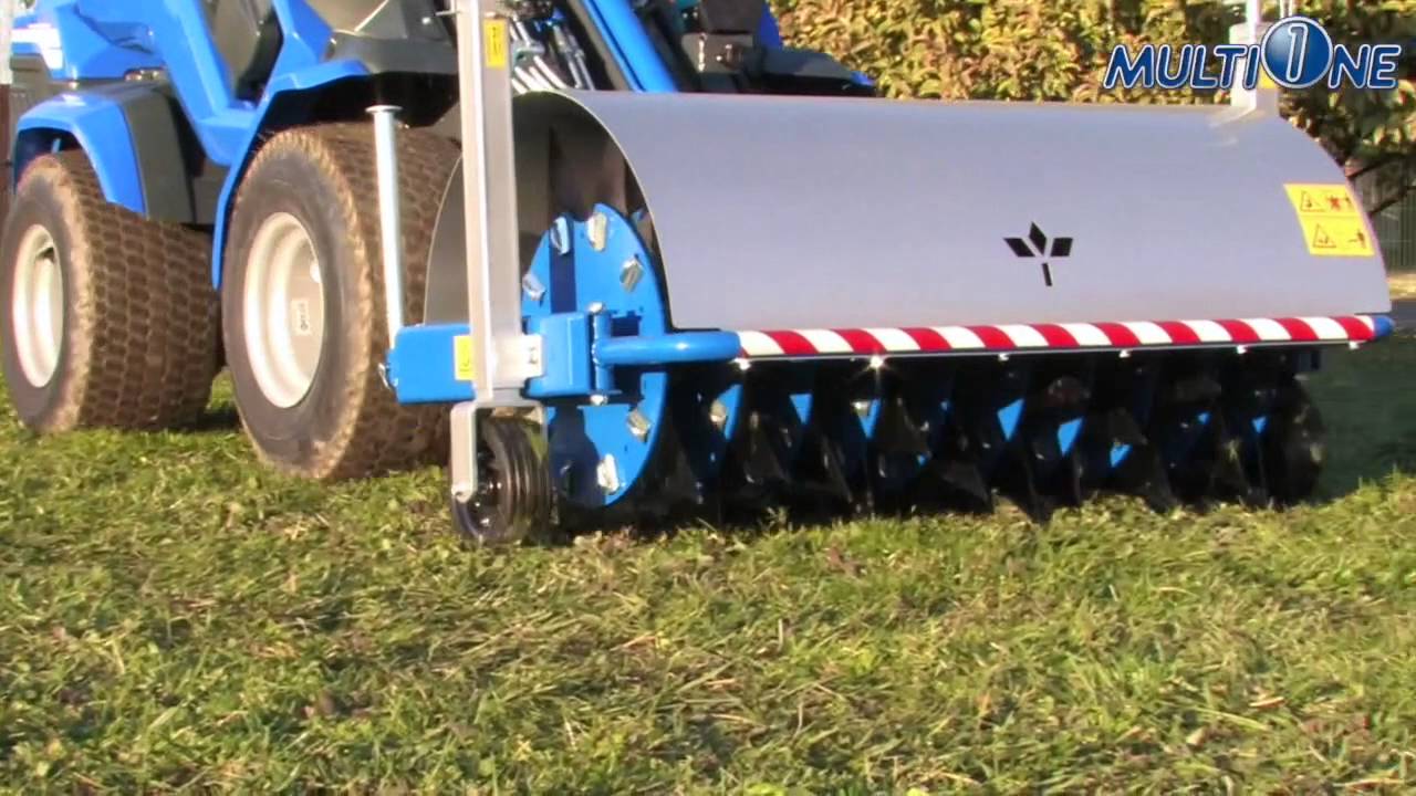 MultiOne Loader with Spike Aerator Attachment