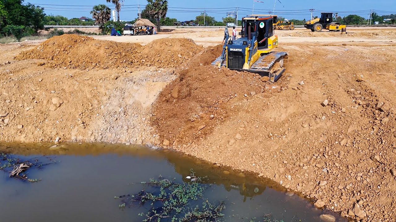 Incredible performance bulldozer pushing soil into water  quickly 