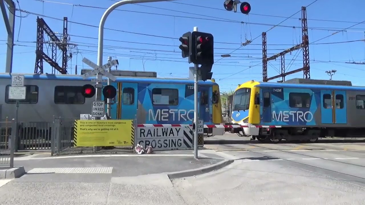 Train And Trams At Glenhuntly Station Crossing