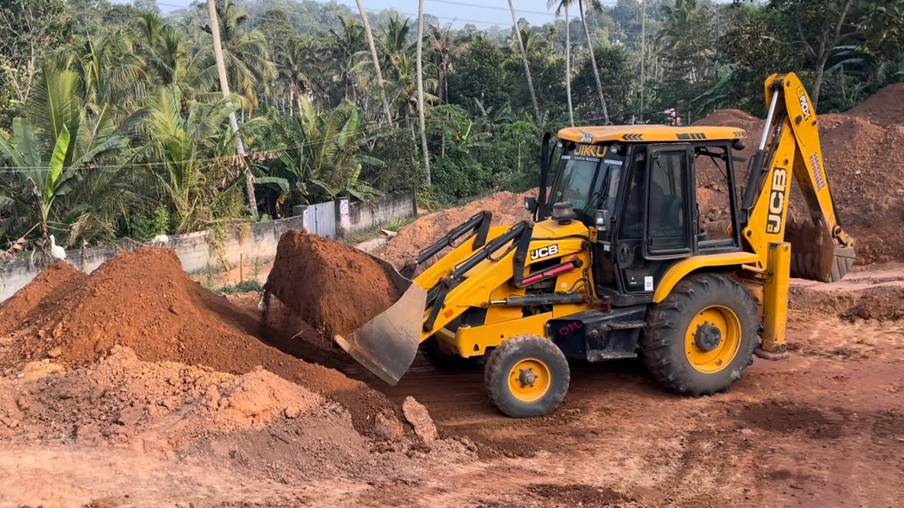 Jcb 3dx dozing and transporting soil through small ramp 