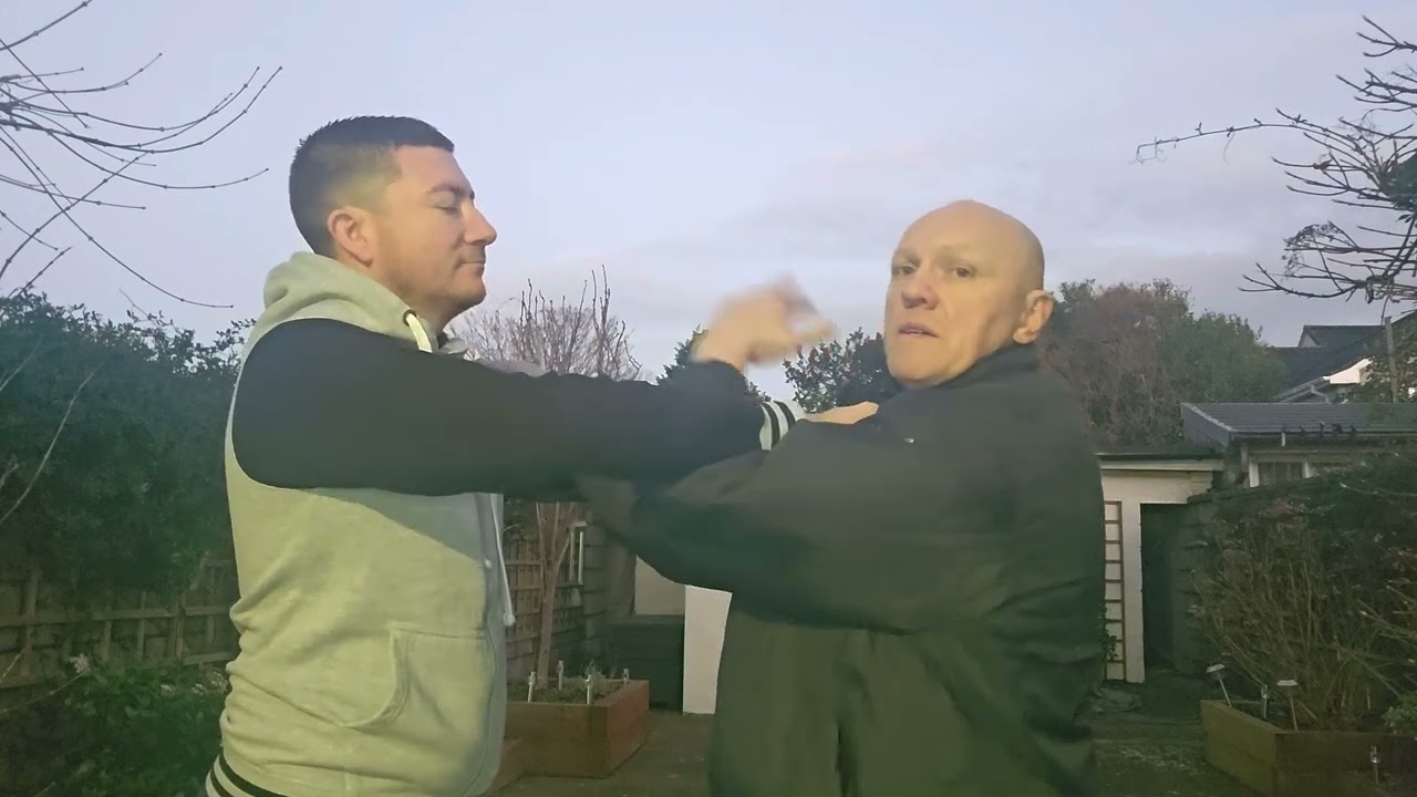 Self defense against a grab from the front