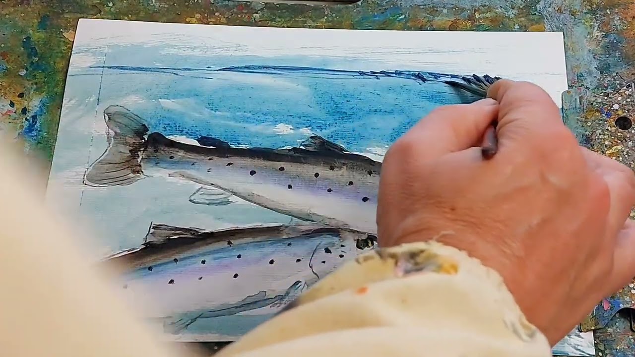 Painting watercolours  in my home studio,  seatrout fish