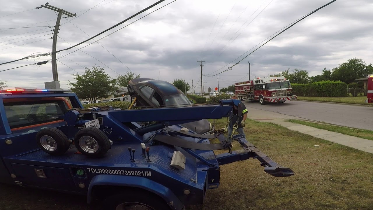 Richland Hills, Texas - Car stuck on Utility Pole Guy Wires