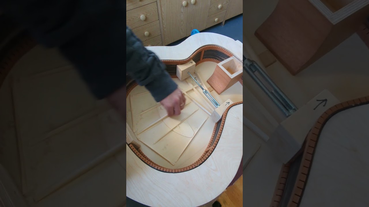 Tuning the soundboard of an acoustic guitar #handcraftedguitars #acousticguitar #acousticdesign