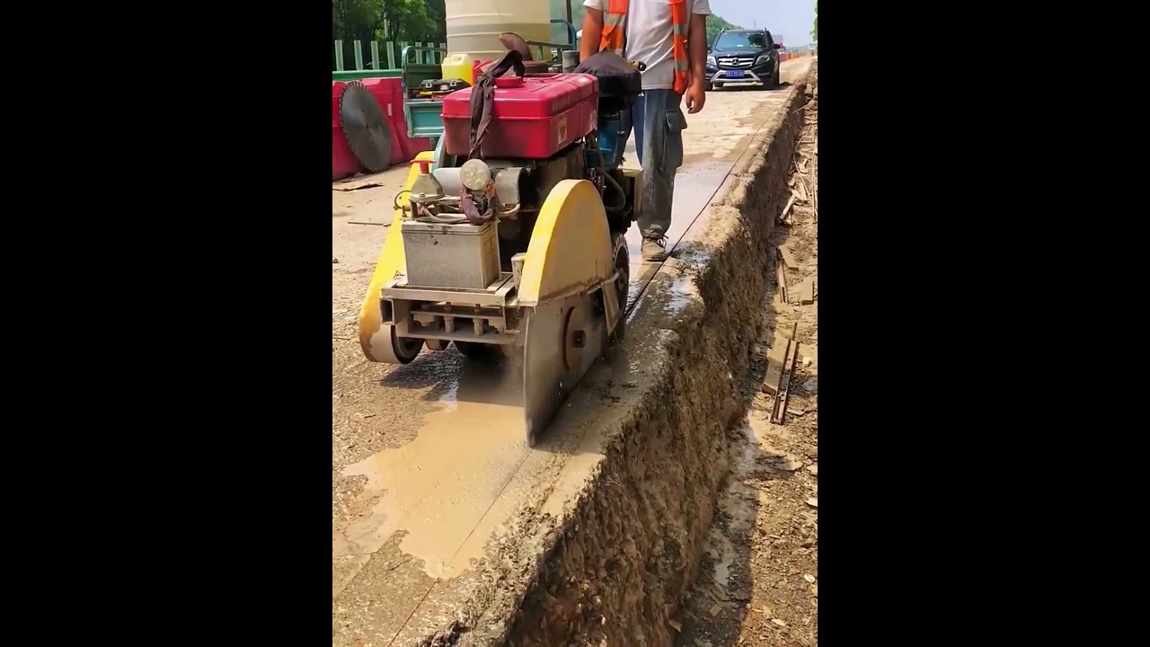 Diesel cutting process along highway road- Good tools and machinery make work easy