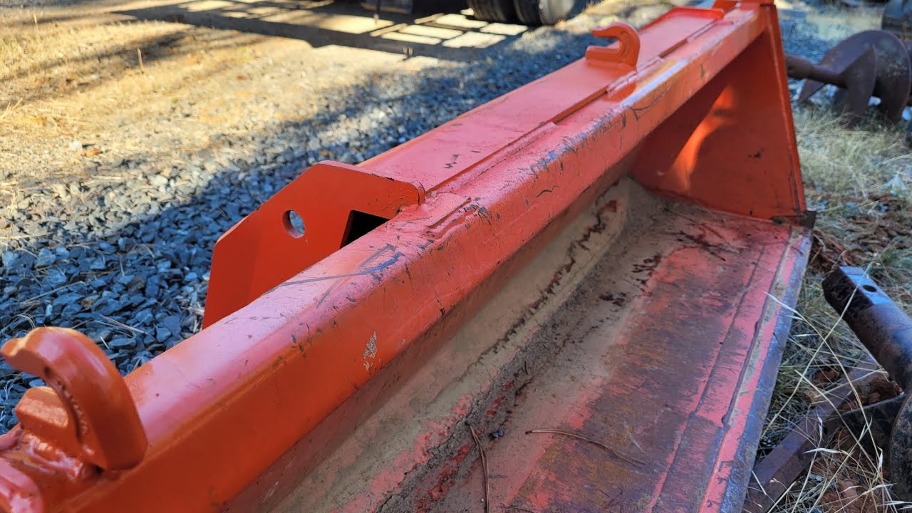 Welding chain hooks to a Kubota bucket something different