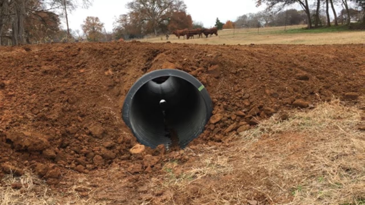INSTALLING A 20-FOOT CULVERT PIPE ~ BRIDGING THE CREEK