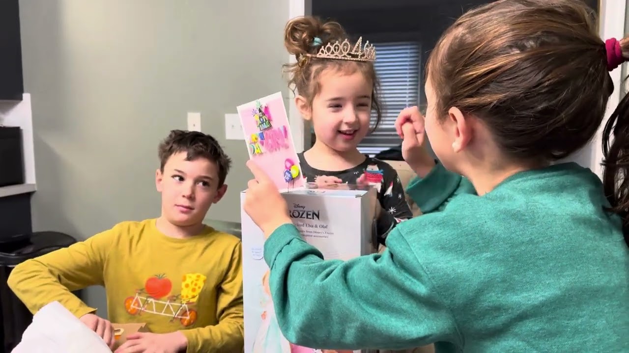 Hartleigh opening presents on her 4th birthday