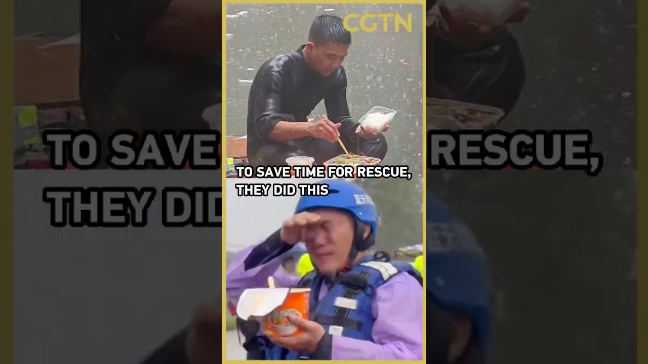 Rescuers eat in the rain in China's flood-hit Guangxi