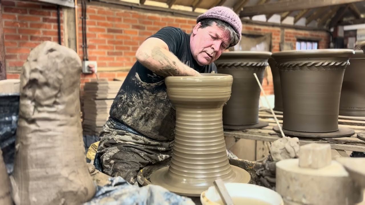 Throwing a terracotta pastry flower pot.