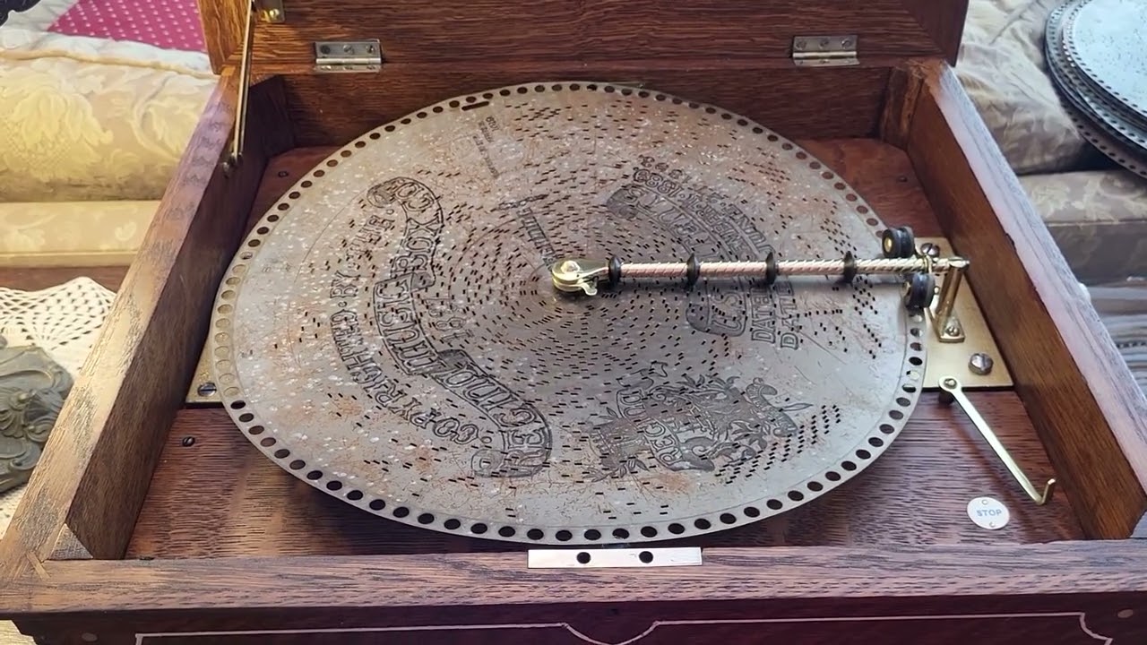 Oak Pinstripe Regina 15.5" music box plays disc 1519, "Washburn - Two Step."