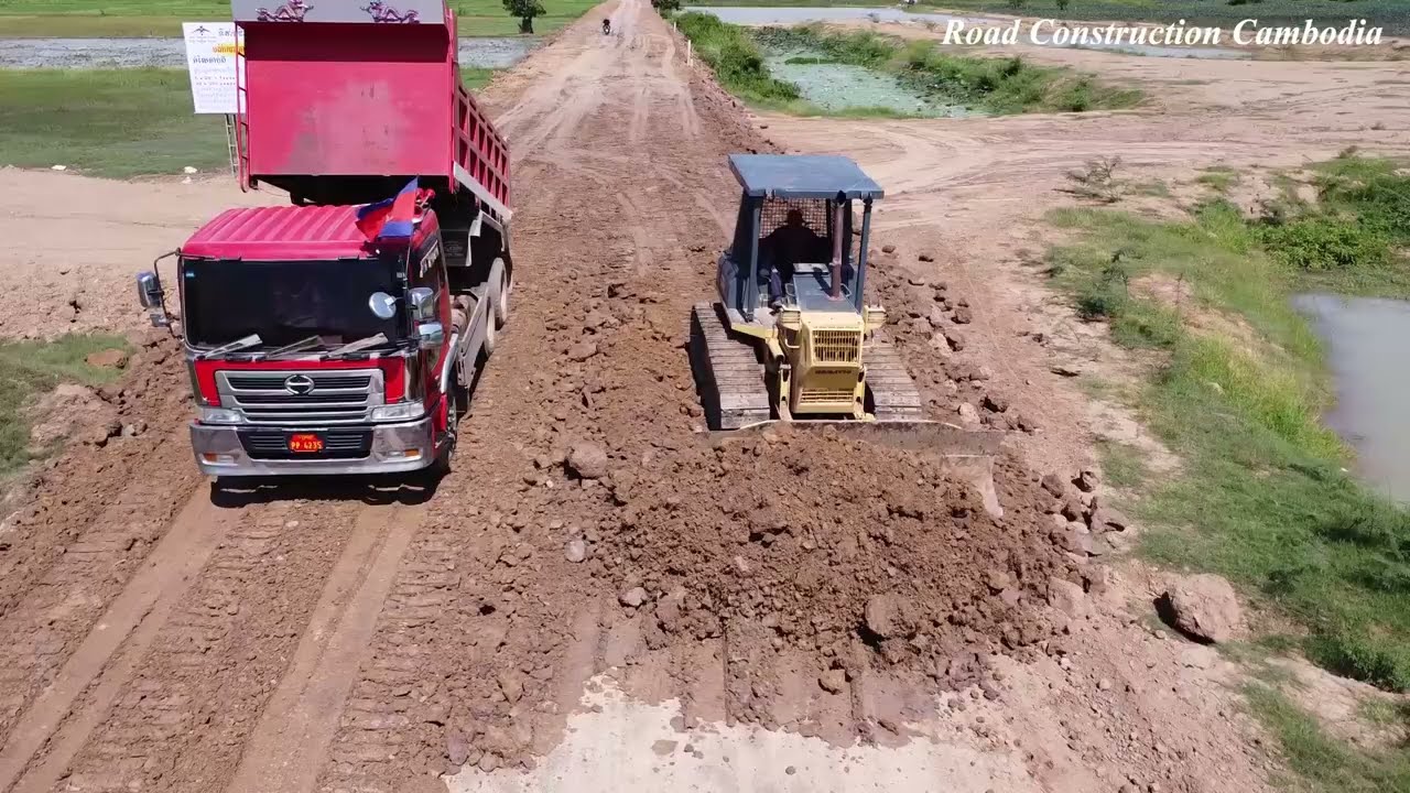 Incredible KOMATSU Dozer D41E Spreading Soil Build Foundation Road And Dump Truck Unloading