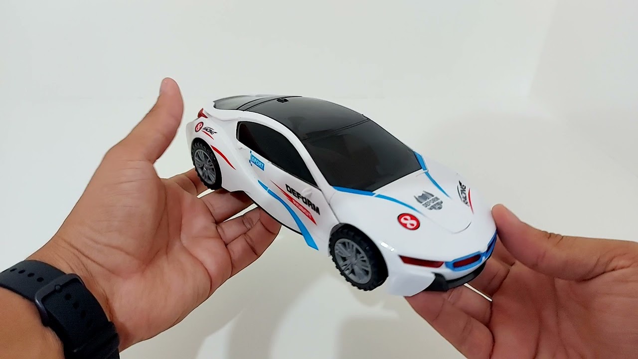 Carrinho Rob&ocirc; Transformers BMW Branco com Luz Som Bate e Volta