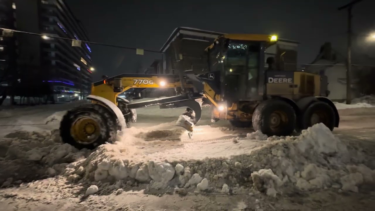 Snow removal operation along Berley avenue and Tay stree 