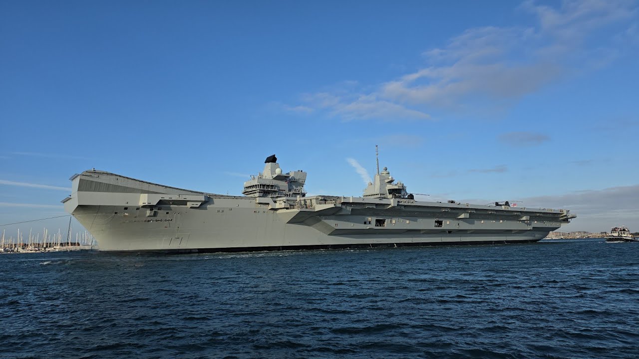 HMS Prince of Wales sailing out of Portsmouth for training around the UK