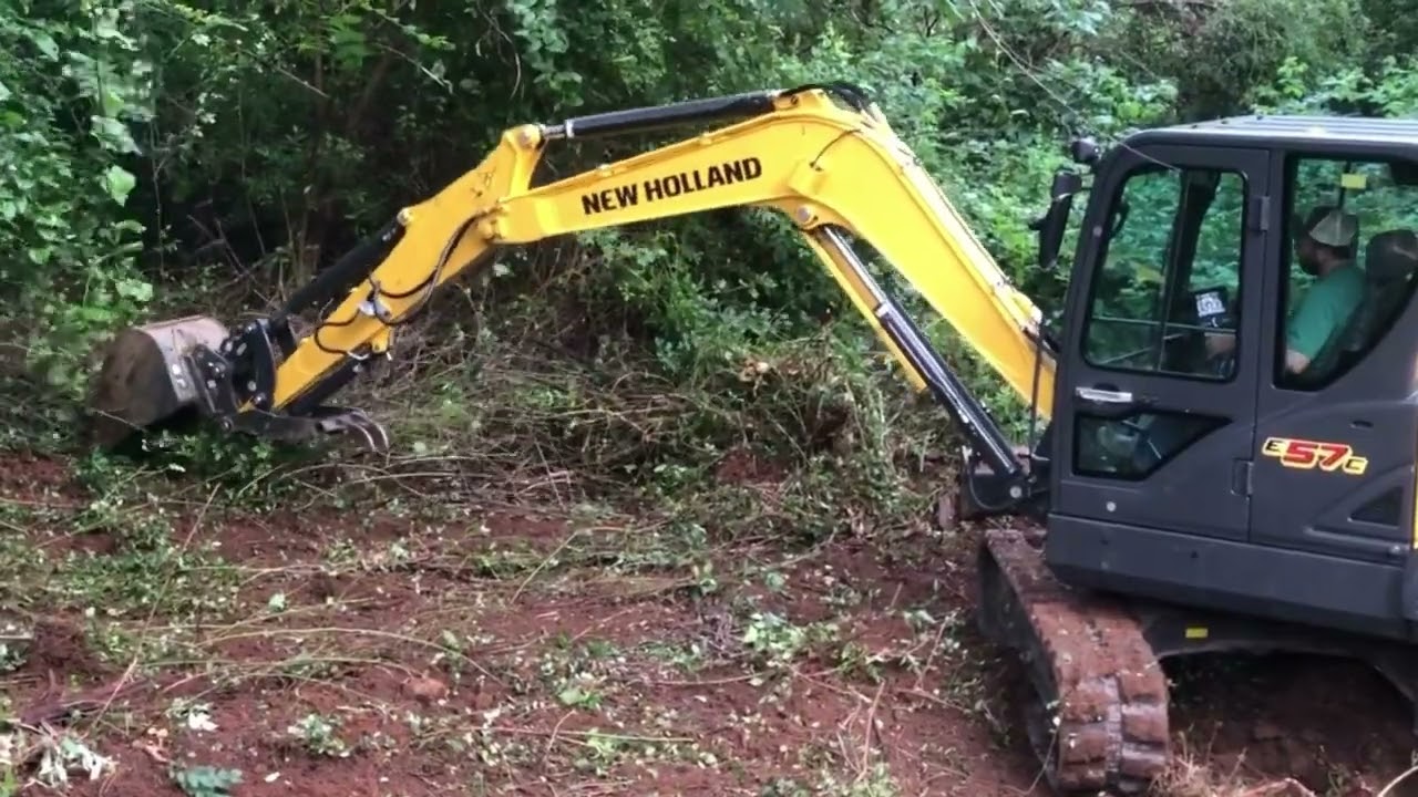 New Holland E57c Excavator - Clearing the back fence line and expanding pasture.