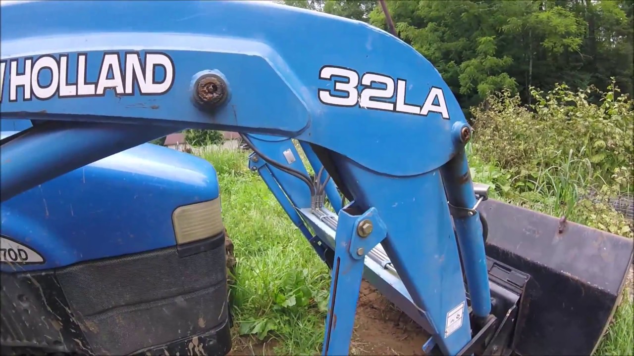 Removing The New Holland  32 LA Loader