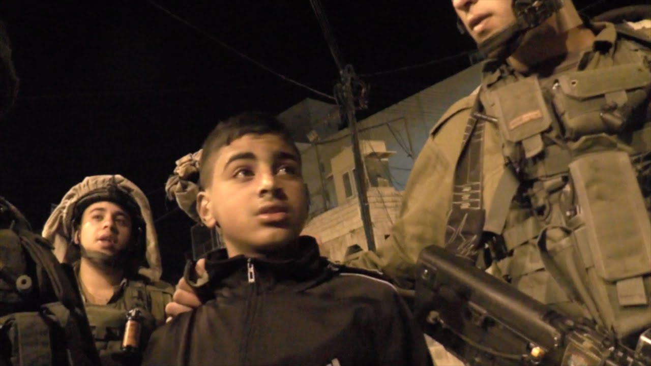 Hebron - Soldiers detain Maher Abu Haya, a minor, threaten wrongful arrest