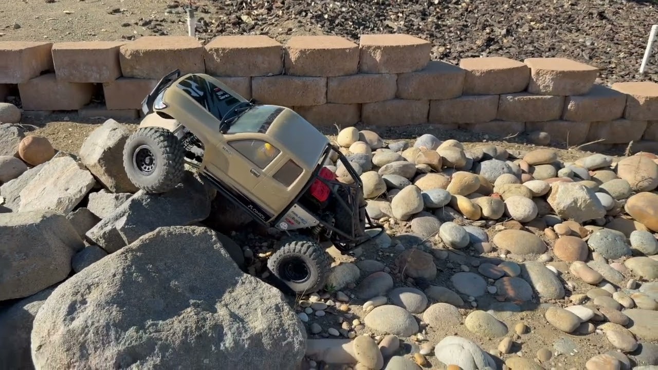RC Crawling SCX6 Honcho in a rock garden 