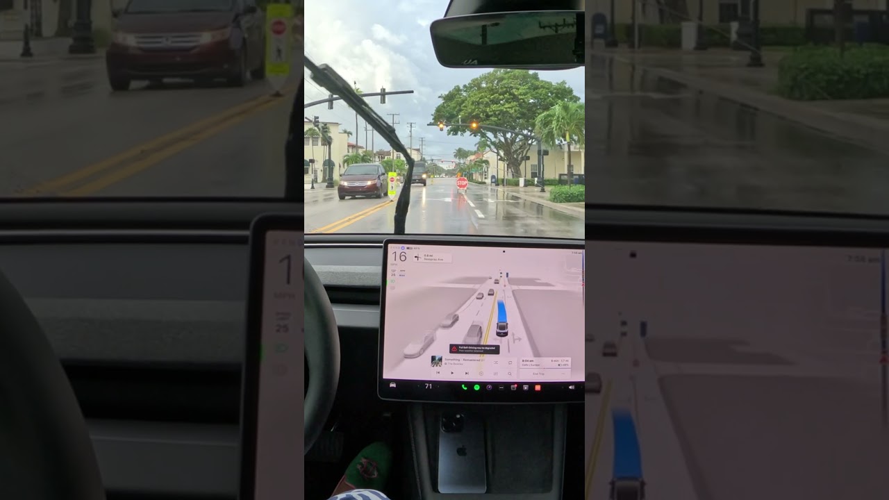 Tesla FSD Navigates Broken Traffic Light and Stop Sign in the Rain