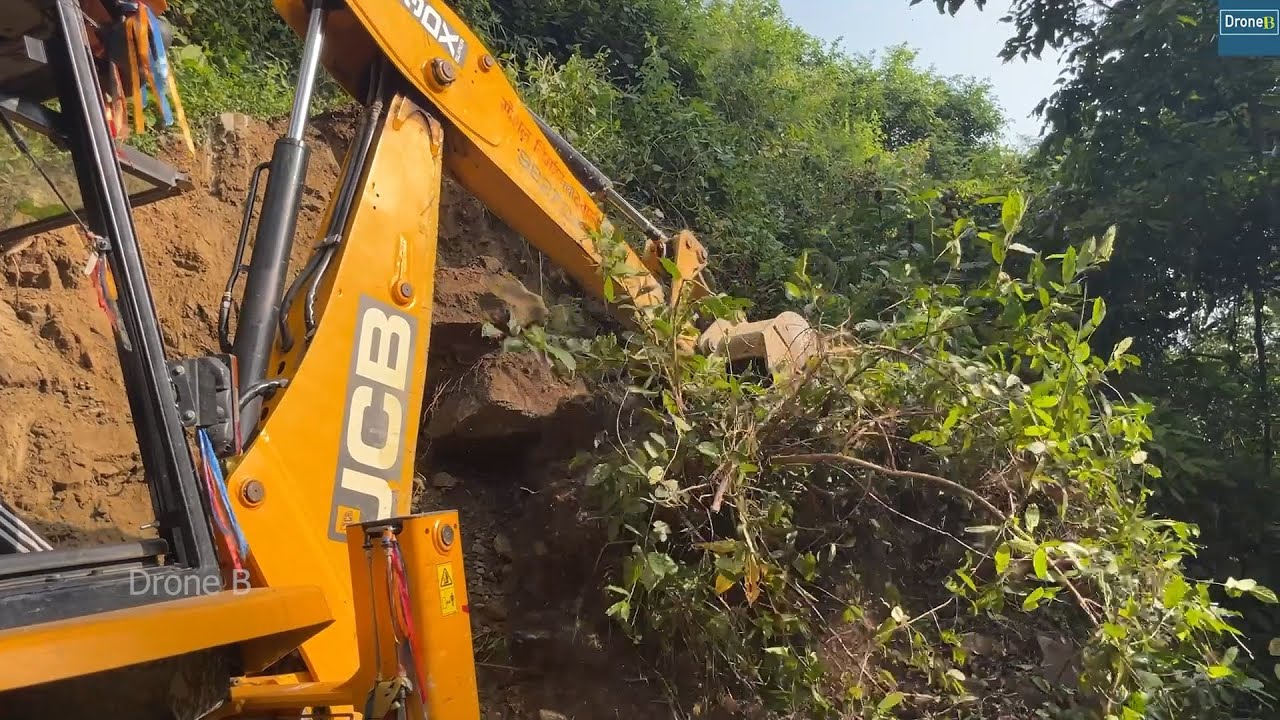 Rolling Down Rocks along with Cutting Hillside with JCB Backhoe for Hillside Road