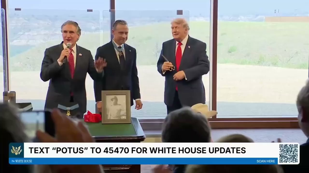 Trump takes the monogrammed scissors from the Teddy Roosevelt ribbon cutting.