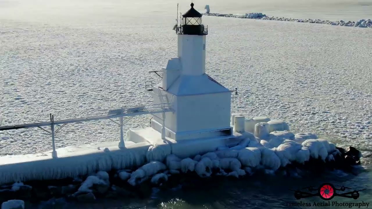 Stunning Ice Waves & Sculptures Left After Blizzard Hits Michigan City Lighthouse 4K Drone Footage