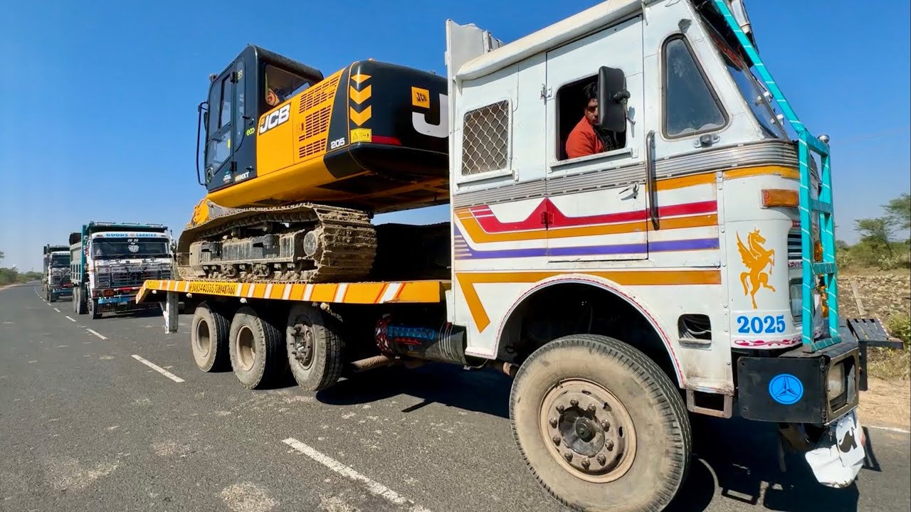 JCB 205 Excavator working with TATA 2518 Trippers Loading Mud TATA Truck 3118 Trailer