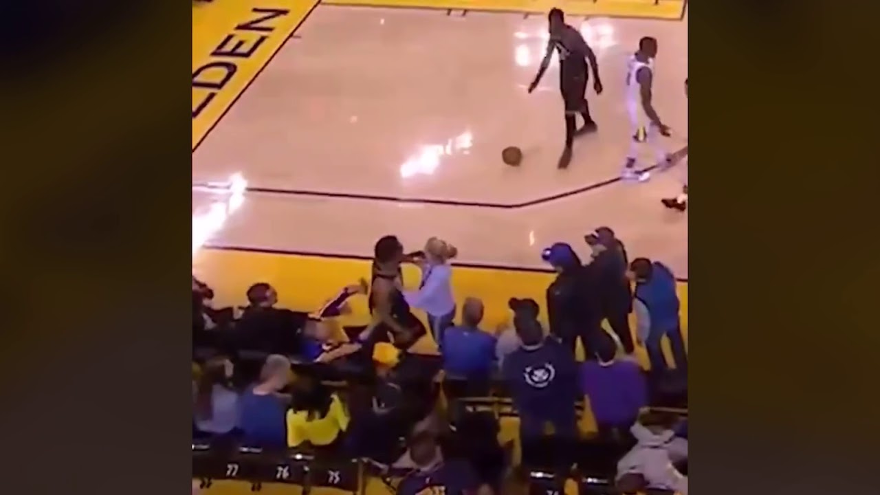 KYLE LOWRY GETS INTO AN ALTERCATION WITH A FAN WHO SHOVES HIM!!