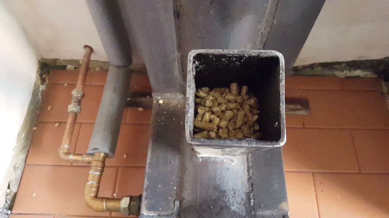 rocket stove, Gravity fed pellet burner Heats a 300 ltr water tank