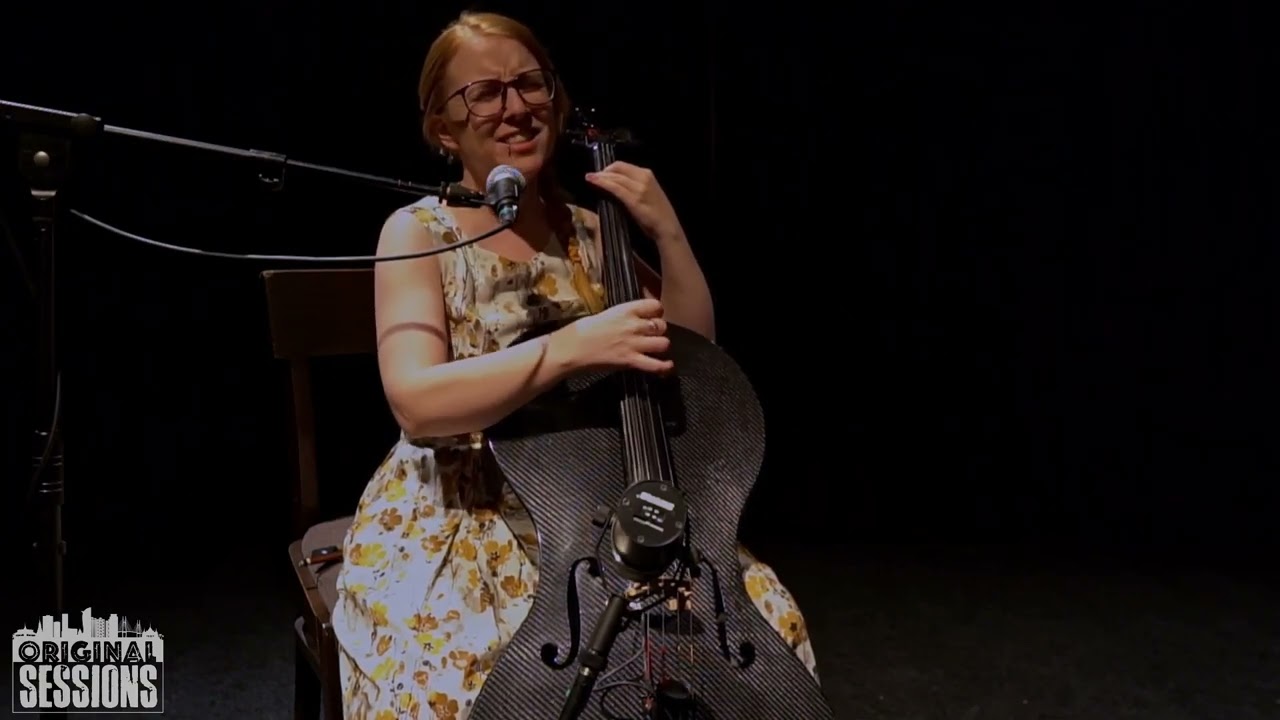 Sidewalk Cellist   Pacific Rain & Trickle Down by Clara Shandler