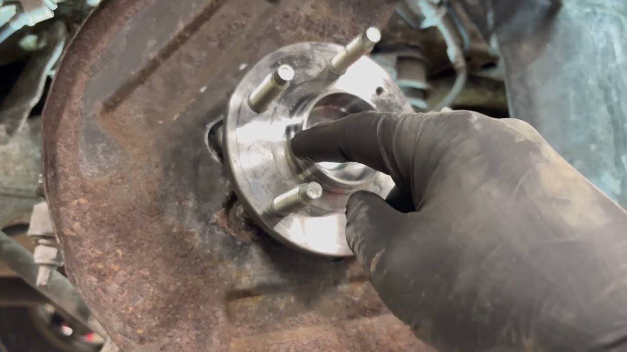 How to replace a Wheel bearing on a 2010 Ford Taurus.