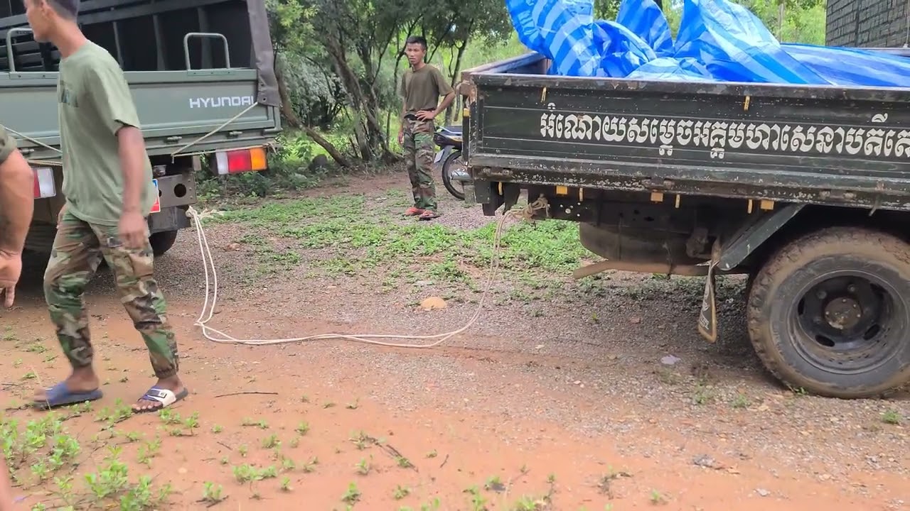 soldier dump truck stuck in mud