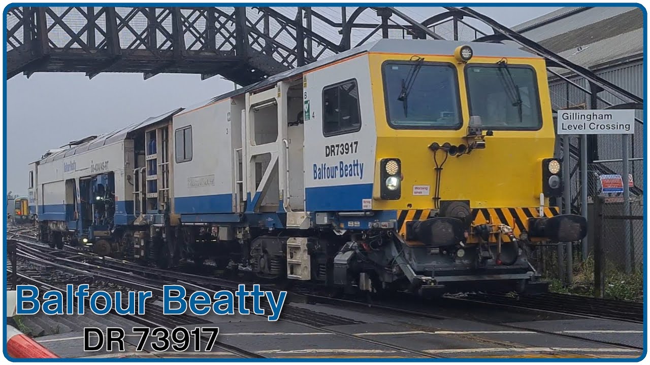 Balfour Beatty Tamper DR73917 (6J06) at Gillingham Level Crossing.