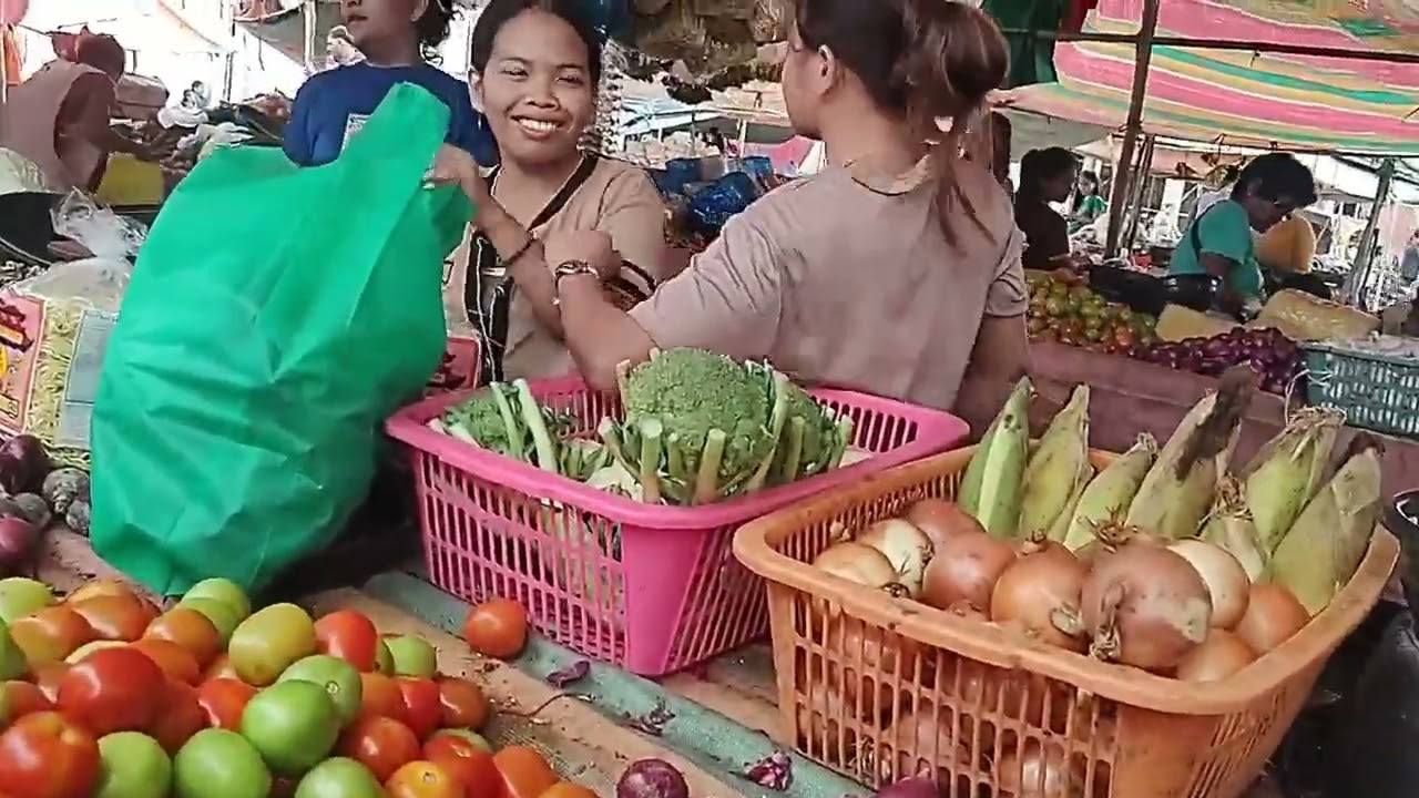 so many vegetables at this market and pretty girls too