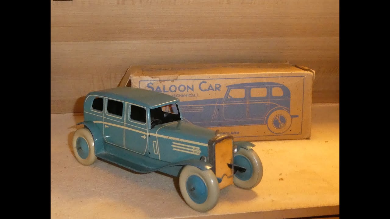 Chad Valley Saloon Car with original box and key.  No. 290