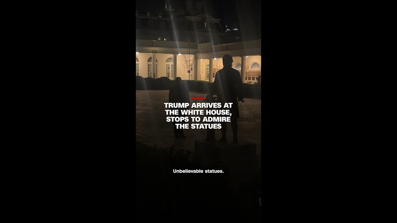 Trump arrives at the White House, stops to admire the statues