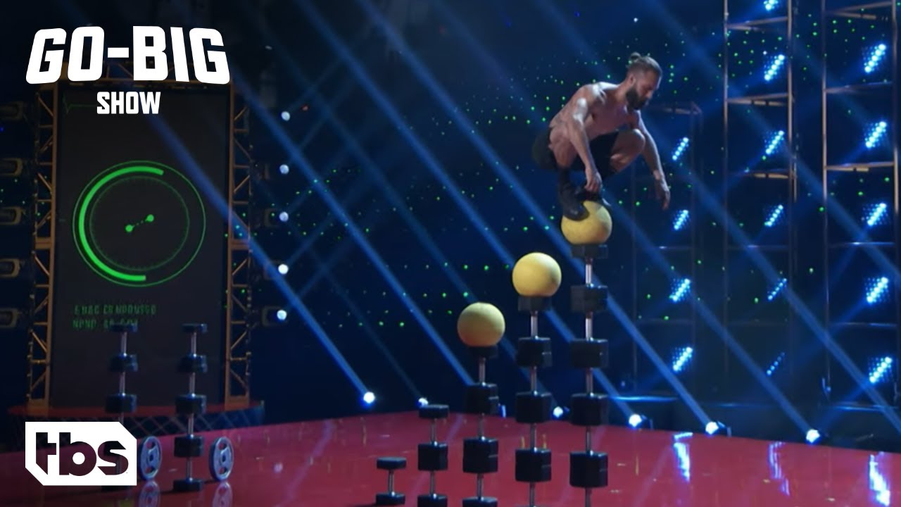 Go Big Show: Contestant Balances on 7 Feet Tall Stack of Weights (Clip) | TBS