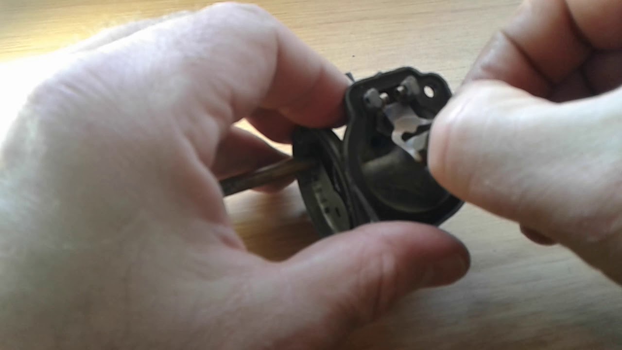 Disassemble carburetor of a 2hp Yamaha, 2hp Mariner outboard two stroke engine.